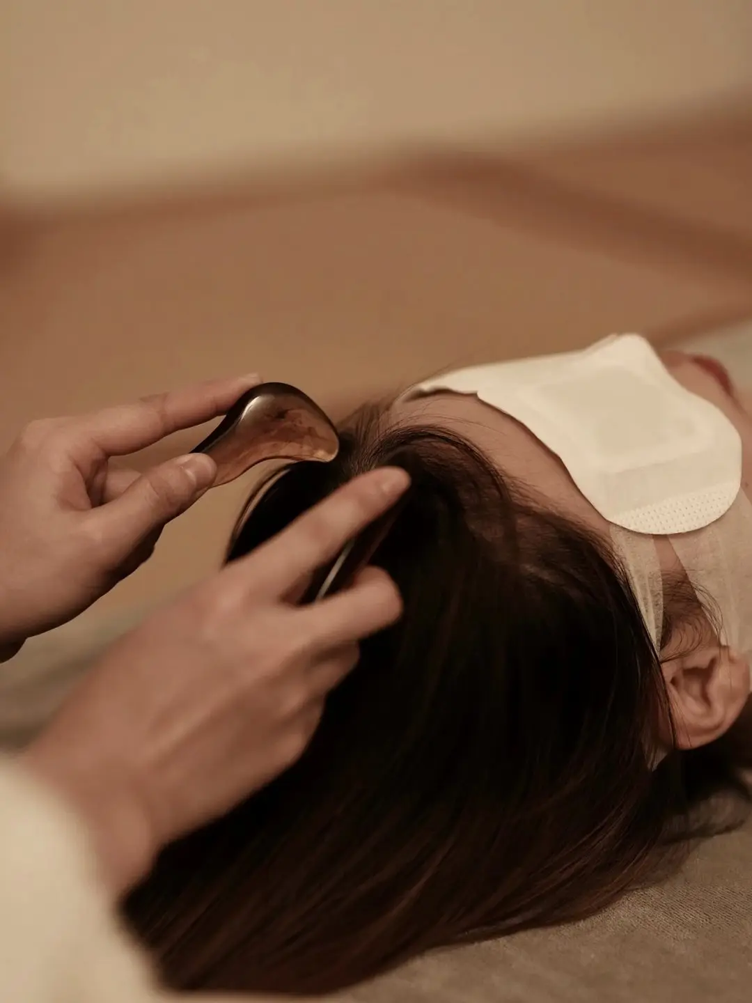 Sectioned scalp cleansing pass during a Keravive treatment at D4 Season Shoreline